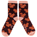 Pair of socks with squirrel pattern on a white background